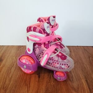 Little Girls Pink and Purple Roller Skates